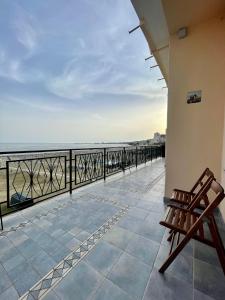 a balcony with a view of the ocean at NEWHOUSE VICTORIA in Nettuno
