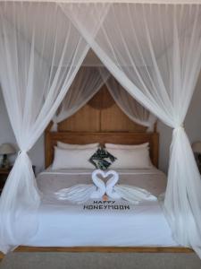 Sawitri Anandhita Luxury Villas客房内的一张或多张床位