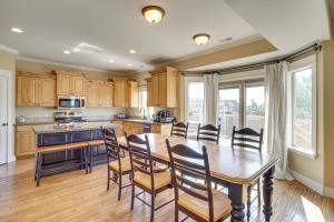 a kitchen with a dining room table and chairs at Spacious Utah Retreat with Deck, Grill and Fire Pit! in Provo