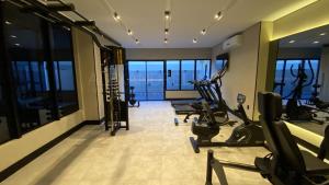 a gym with treadmills and exercise equipment in a building at Sky Concept in Maceió