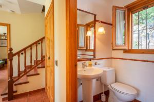 a bathroom with a toilet and a sink at Can Caldeta - Naturaleza y privacidad en el Montseny in gualba de Dalt +35 photos