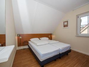 Postel nebo postele na pokoji v ubytování Holiday home on a holiday park near Hellendoorn