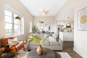 a living room with a couch and a table at Spacious 4B Oasis steps from French Quarter - Your NOLA Dream Awaits! in New Orleans +44 photos