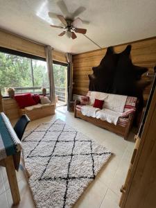 a room with a bedroom with a bed and a window at Les Camparoles in Font Romeu Odeillo Via