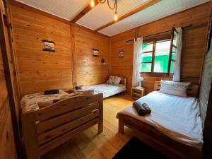 Postel nebo postele na pokoji v ubytování Apartman KOD PECE