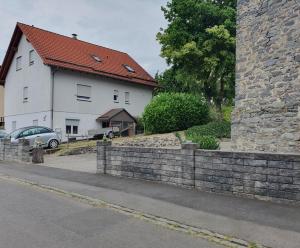 a stone retaining wall in front of a house at Casa Vogelsberg in Schotten