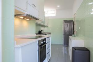 Kuchyň nebo kuchyňský kout v ubytování Succeed Campo Pequeno Guest House + 4 fotografie