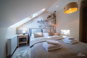 מיטה או מיטות בחדר ב-Apartament Silence Stone Hill Jaspis