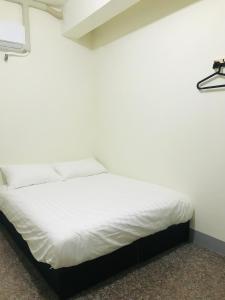 Una cama o camas en una habitación de Starry Sky Hostel