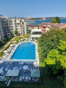 an overhead view of a swimming pool in a city at 3 Room Penthouse Apartment with fantastic Seaview and big Terraces OASIS Ravda in Ravda