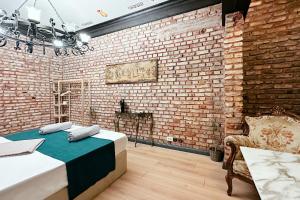 a room with a bed and a brick wall at The Haliç Bosphorus Hotel in Istanbul