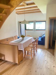 a kitchen and dining room with a table and chairs at Apartment Steinwänd Top 8 in Grünau im Almtal