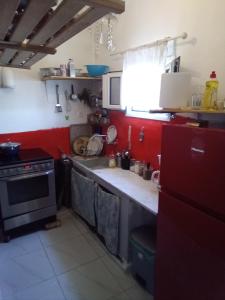 a kitchen with a sink and a stove at Marathon agios panteleimon attiki Greece in Panayía Mesosporítissa