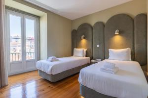 Postel nebo postele na pokoji v ubytování Liberdade Concept 3BDR Apartment by LovelyStay