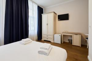 Postel nebo postele na pokoji v ubytování Stabu Sēta Residence