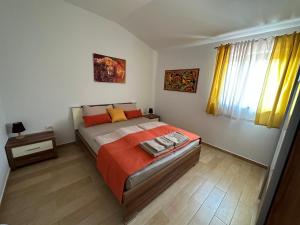 Postel nebo postele na pokoji v ubytování Grad Inn Apartments & Resort