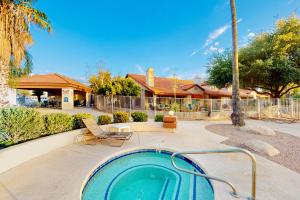 a hot tub in a yard with a house at Tucson National #8689 in Tucson