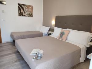 Postel nebo postele na pokoji v ubytování Hotel Madera