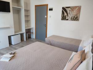 Postel nebo postele na pokoji v ubytování Hotel Madera
