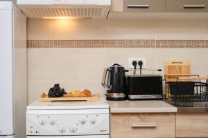 Η κουζίνα ή μικρή κουζίνα στο Apartment Galeriana Palace by Litto +55 φωτογραφίες