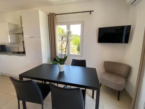 Телевизор и/или развлекательный центр в La Citadelle Appartements
