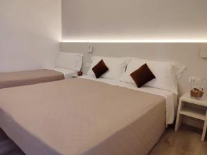 Postel nebo postele na pokoji v ubytování Hotel Madera