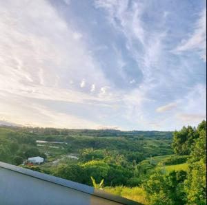 a view of the countryside from a window of a house at VILLA La DOLCE VITA in Sainte-Marie
