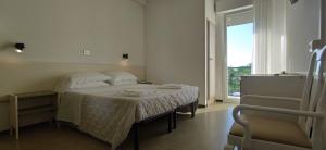 Postel nebo postele na pokoji v ubytování Hotel Internazionale