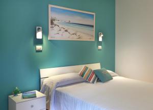 Posteľ alebo postele v izbe v ubytovaní B&B Happy Days Golfo di Gallipoli