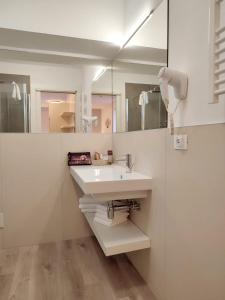 Koupelna v ubytování Hotel Madera