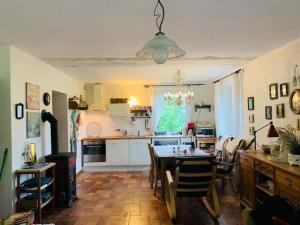 a kitchen and dining room with a table and chairs at Tutaj Sielankowo in Ustroń