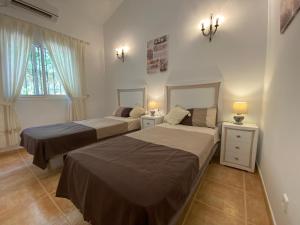 A bed or beds in a room at Villa Las Golondrinas