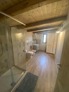 a large bathroom with two toilets and a shower at Lovely Country House in Trappeto
