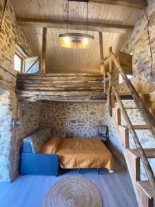 a bedroom in a tiny house with a bed at Lovely Country House in Trappeto