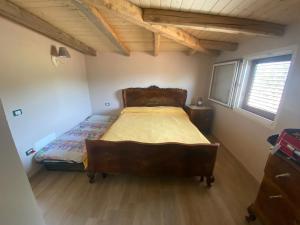 a bedroom with a large bed in a room at Lovely Country House in Trappeto