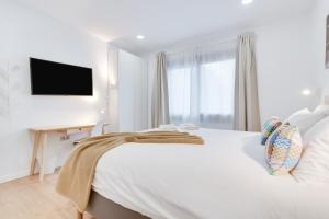 Posteľ alebo postele v izbe v ubytovaní Casa Boissier Ciudad Jardín