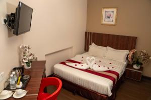 Postel nebo postele na pokoji v ubytování Hotel Eastana Ipoh
