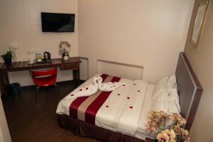 Postel nebo postele na pokoji v ubytování Hotel Eastana Ipoh