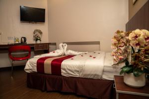 Postel nebo postele na pokoji v ubytování Hotel Eastana Ipoh