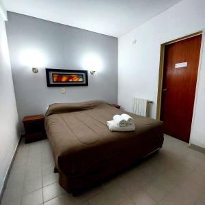 Een bed of bedden in een kamer bij Posada del Angel