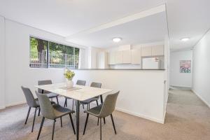 a kitchen and dining room with a table and chairs at Castle HIll Sweet Modern 3BR Apt with 2 Parking in Castle Hill