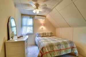 a bedroom with a bed and a ceiling fan at Cozy Cohocton Cottage with Private Beach and Deck! in Cohocton