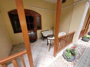 an aerial view of a porch with a chair and a door at Penzión Korzo in Štúrovo