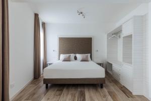 Posteľ alebo postele v izbe v ubytovaní Hotel Giardinetto