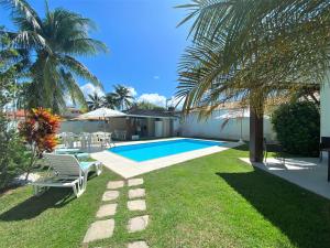 La alberca dentro o cerca de Casa Canto do Mar Guarajuba