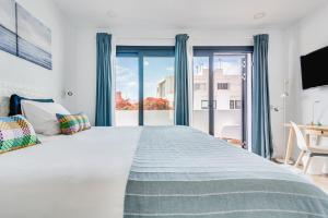 Posteľ alebo postele v izbe v ubytovaní Casa Boissier Ciudad Jardín