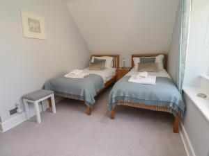 Postel nebo postele na pokoji v ubytování Alnside Cottage