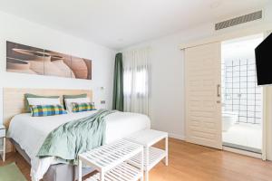 Posteľ alebo postele v izbe v ubytovaní Casa Boissier Ciudad Jardín