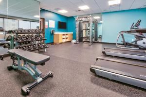 a gym with treadmills and machines in a room at avid hotels - Austin - Tech Ridge, an IHG Hotel in Austin