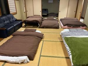 Voodi või voodid majutusasutuse 民宿ふじ苑 toas